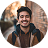 cheerful young man outdoors.png